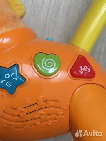 Игрушка каталка музыкальная Игрушка каталка музыкальная